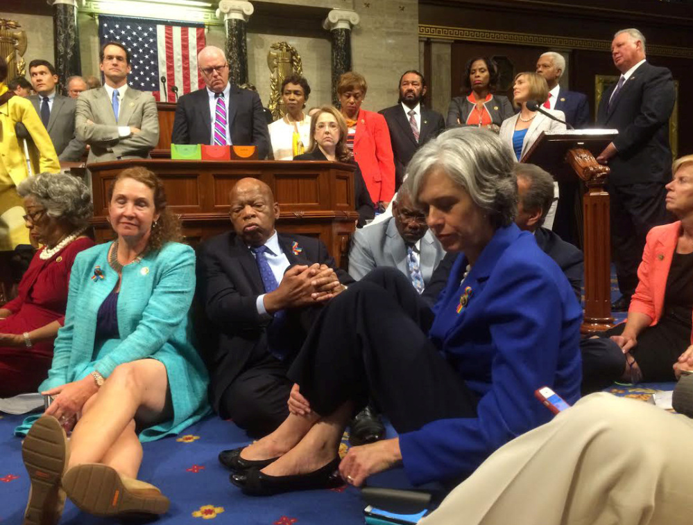A photo shot and tweeted from the floor of the U.S. House of Representatives shows Democrats staging a sit-in Wednesday on the House floor "to demand action on common-sense gun legislation."