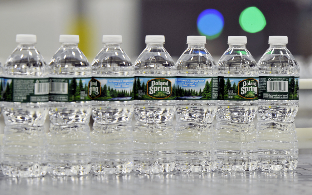 Bottles of Poland Spring water Shawn Patrick Ouellette/Staff Photographer