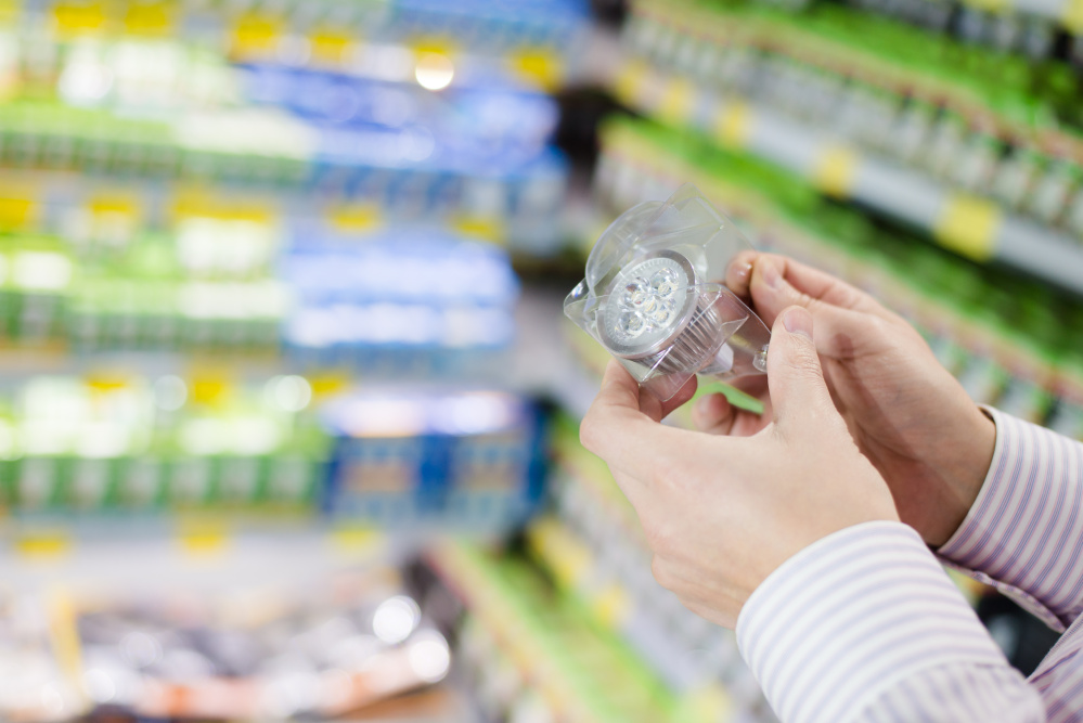 A shopper examines a display of LED offerings. The savings from switching to LED bulbs can be big, especially if you still have incandescents. They use 83 percent more electricity than LEDs.