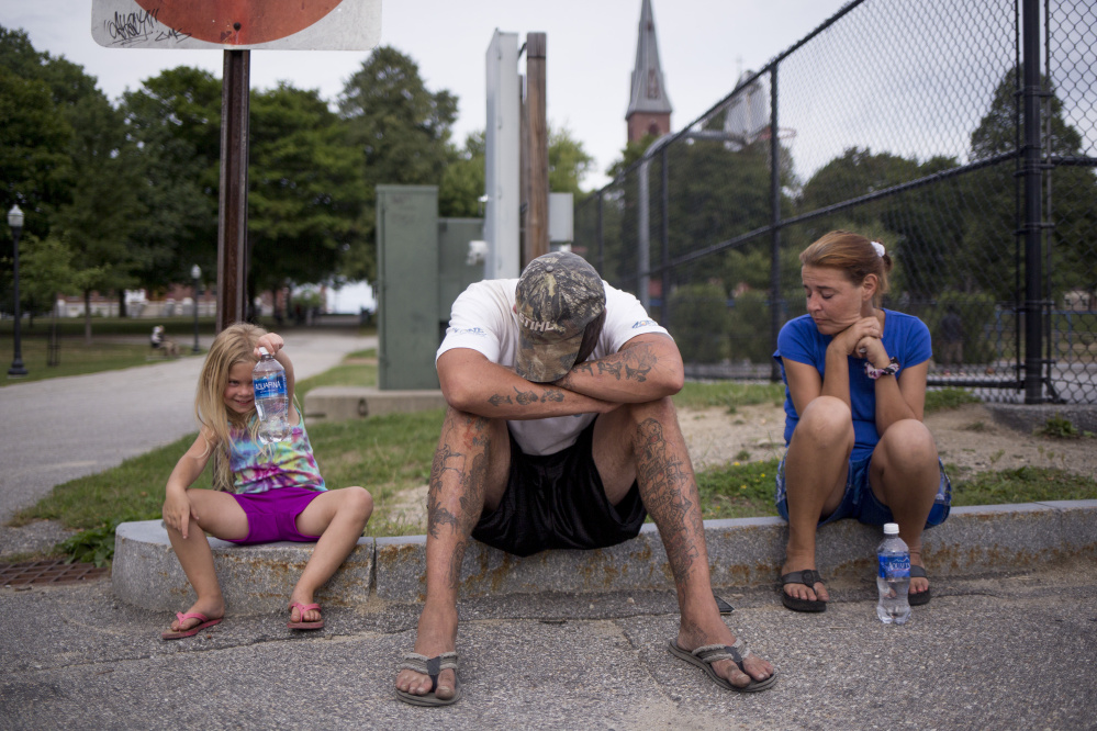 Troy and Chrissy wait in Kennedy Park in Lewiston to hear from the property management company or the landlord. Upon arriving in Lewiston, they found out they had not been approved for an apartment in Auburn and that they might need more references. With the encampment in the woods in Portland no longer an option they had nowhere else to go.