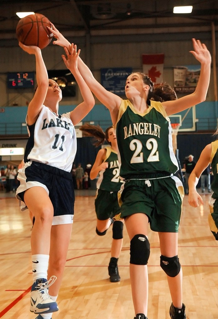 Emily Carrier of Rangeley blocks a shot by Greenville’s McKenna Peat.