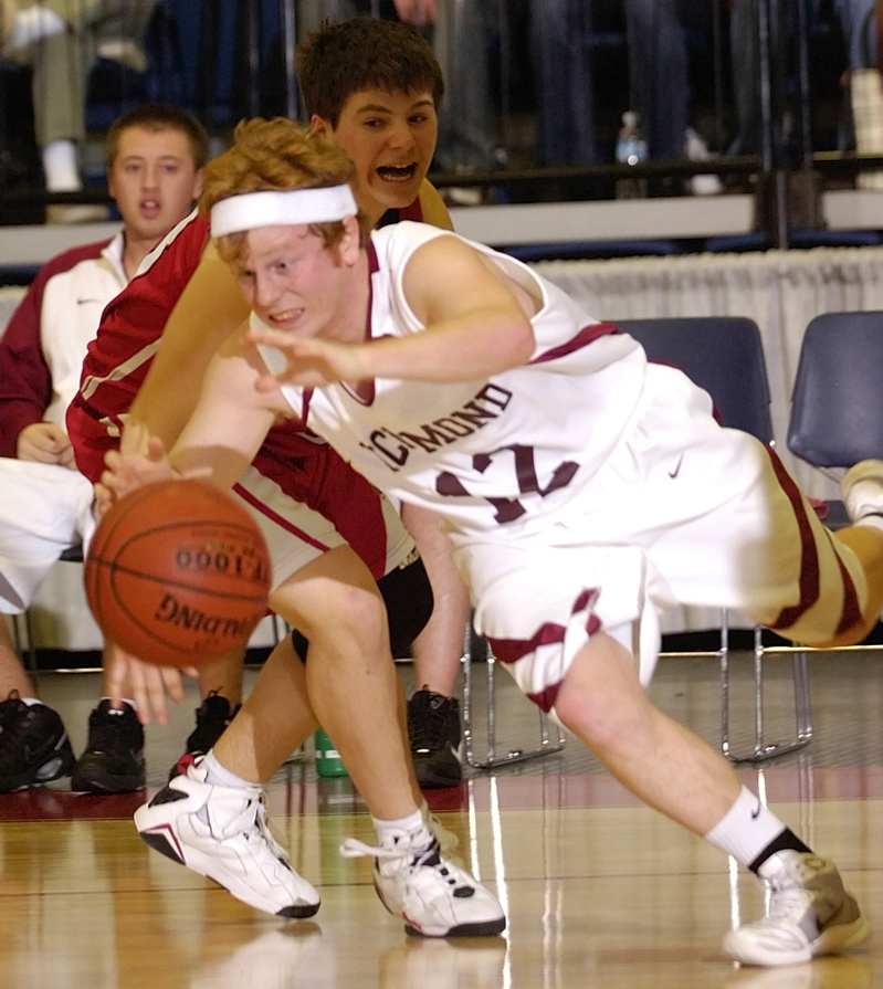 Eric Dowd of Richmond dribbles past Robert Beckham of Vinalhaven during their Western Class D championship game at the Augusta Civic Center. Richmond won 47-32 and will meet Schenck for the state title.