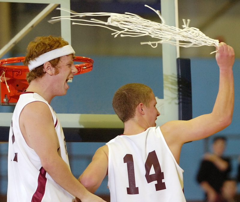 Eric Dowd, left, and Nick Woods celebrate after Richmond's 47-32 win.