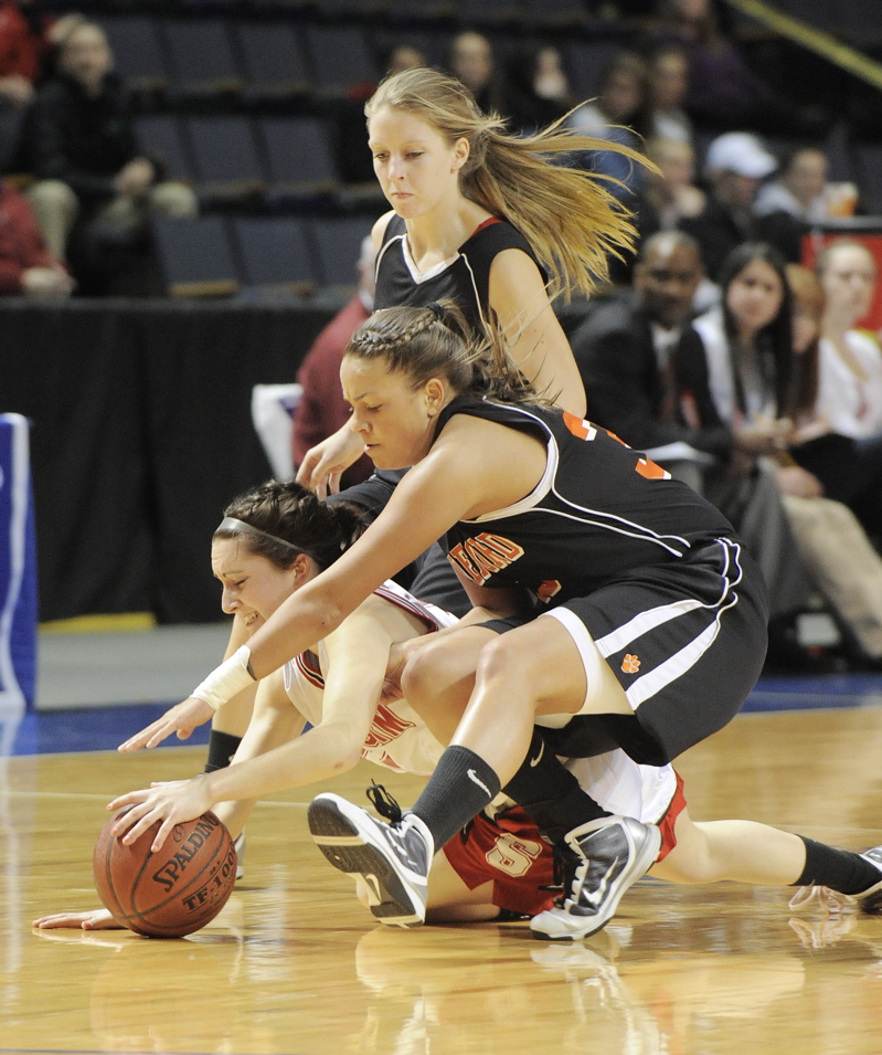 Scarborough's Brittany Ross, bottom, and Lauren Rousseau of Biddeford chase a loose ball along with Biddeford's Jacklyn McCurry.