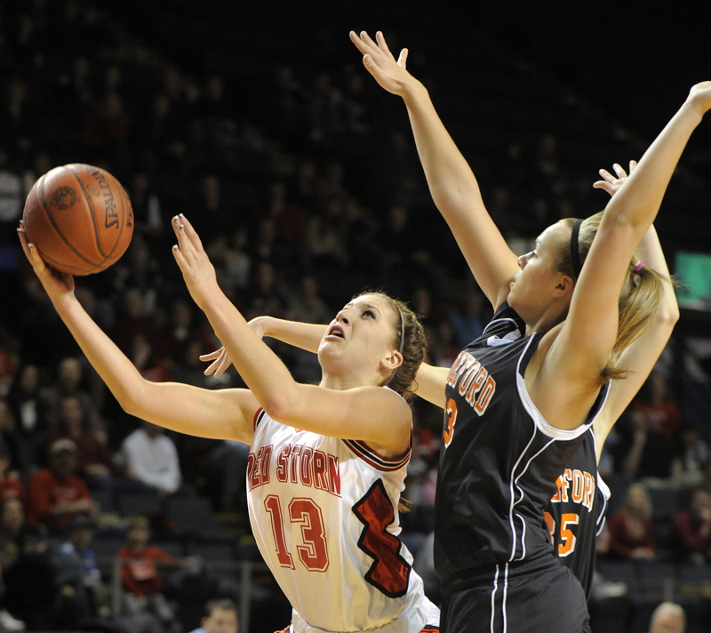 Ellie Morin, who stepped into a starting role for Scarborough because of a season-ending injury to Jenn Colpitts, drives to the basket ahead of Keila Grigware of Biddeford during Scarborough’s 39-29 victory at the Cumberland County Civic Center. Morin scored nine points.