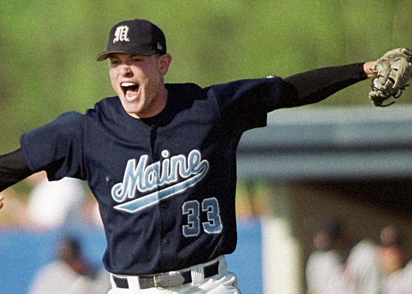 AP File Photo | Maine closing pitcher Mike Collar (33) rejoices in 2002, in Orono,