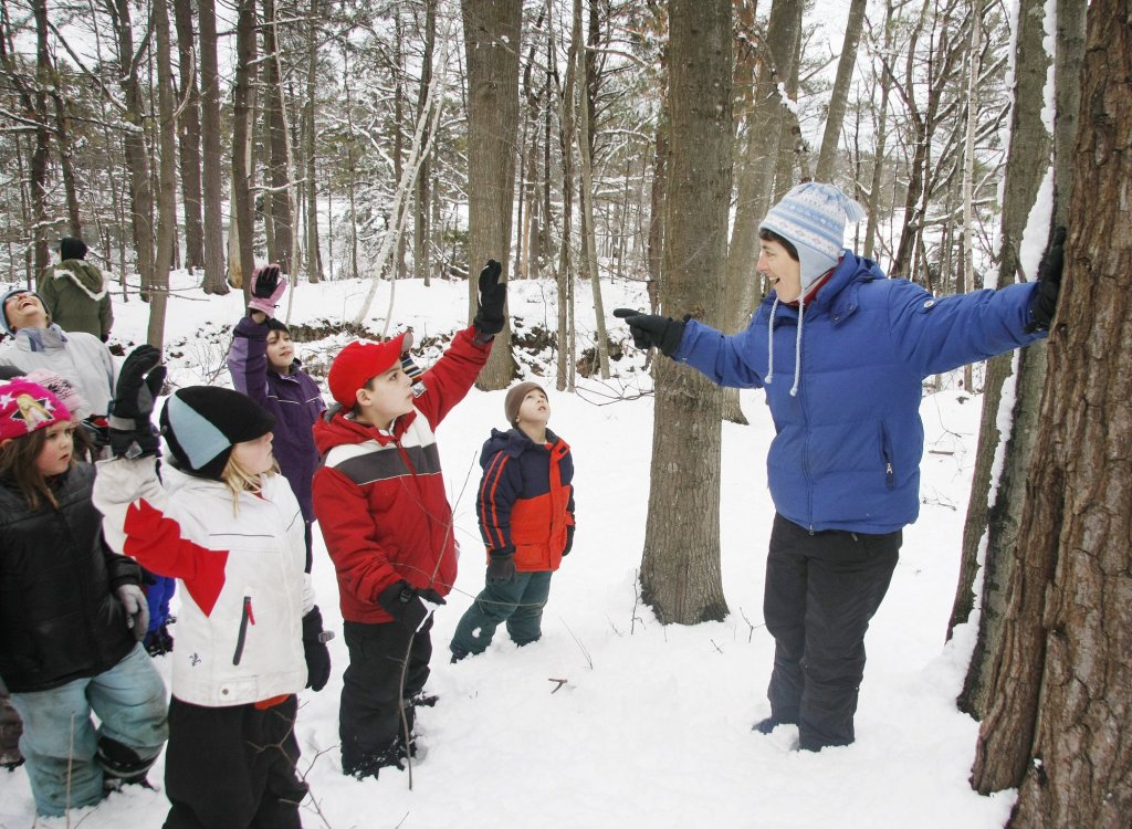 Suzanne Petersen, right, of Dover, N.H., a naturalist and volunteer, leads a group of children from the Kittery Recreation Department on a nature walk as part of last month’s Family Fun Day at Fort McClary State Historic Site in Kittery.