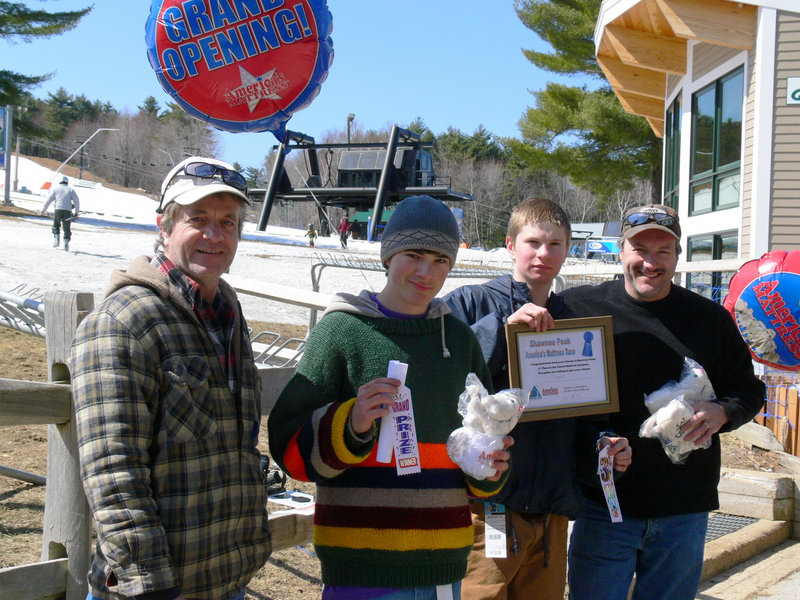 Team Tank returning champions, from left, Paul Armington, Tyler Nadeau, Adam Armington and Keith Nadeau, pose in the winner's circle after Shawnee Peak's mattress race.