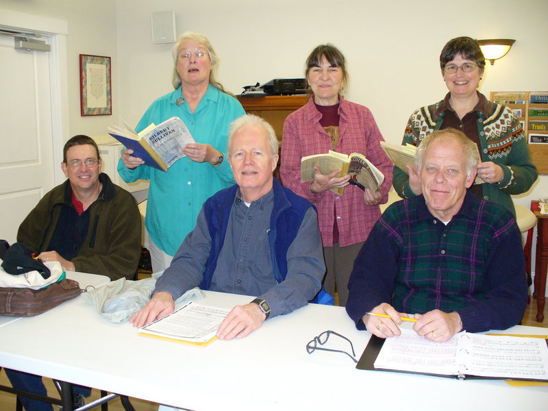 Savoyard Sing chorus members rehearsing are, from the left, in front, Rick Gatewood, John Chase and Peter Clain. In back are Judy Rock, Jean Goldfine and Sandy Hall.