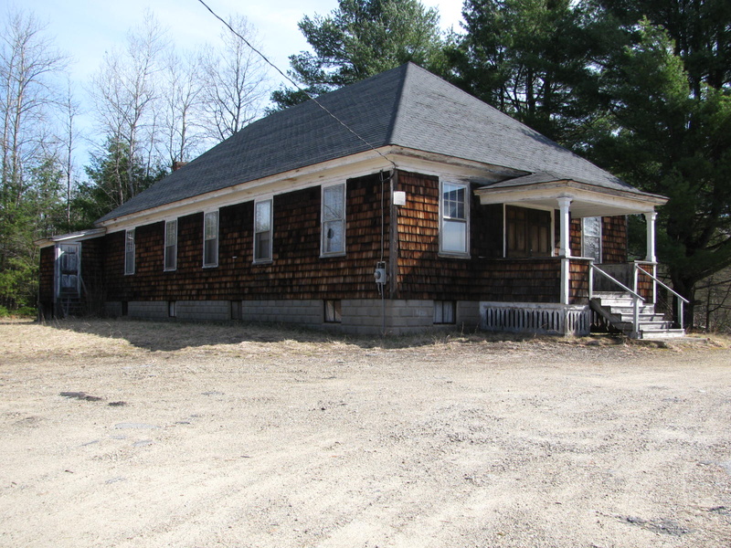 The building is a classic 1950s-style country hall.