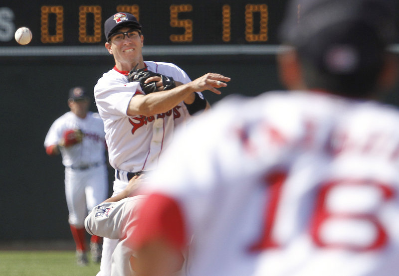 Nate Spears of the Portland Sea Dogs throws to first baseman Will Vasquez to complete a double play Sunday in the ninth inning of the 8-4 victory against the New Britain Rock Cats at Hadlock Field. The teams will meet again today in a game that will be televised by NESN.