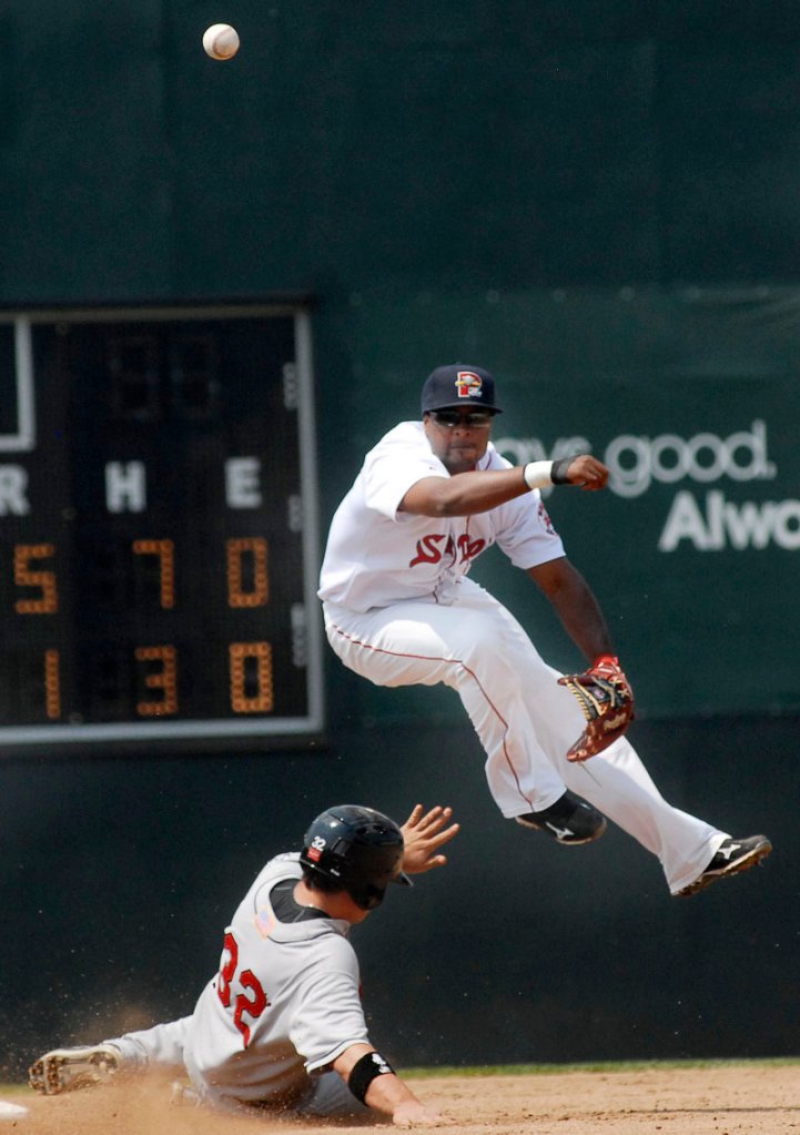 Eric Lis of the New Britain Rock Cats can’t break up a double play turned by Sea Dogs shortstop Yamaico Navarro.