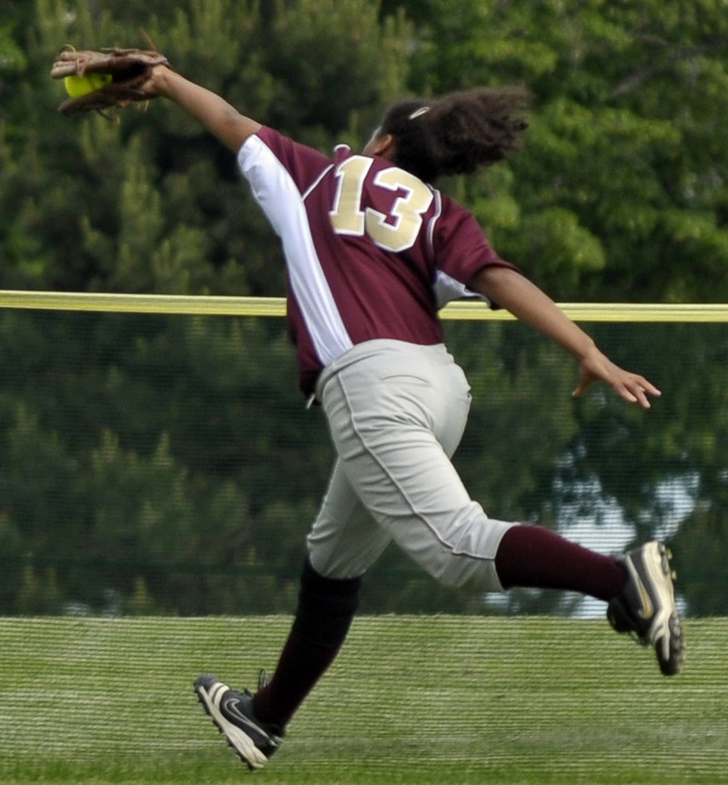 Kristin Duross of Thornton Academy makes a lunging grab of a liner in left field headed for extra bases, helping to squelch a Cheverus rally in the first inning of a Western Class A quarterfinal Friday. Thornton advanced with a 5-2 win.