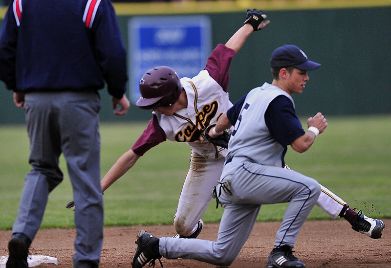 Cameron Brown of Cape Elizabeth is tagged out by Yarmouth second baseman Travis Merrill during the Capers’ 5-1 victory Wednesday night in the Western Class B final.