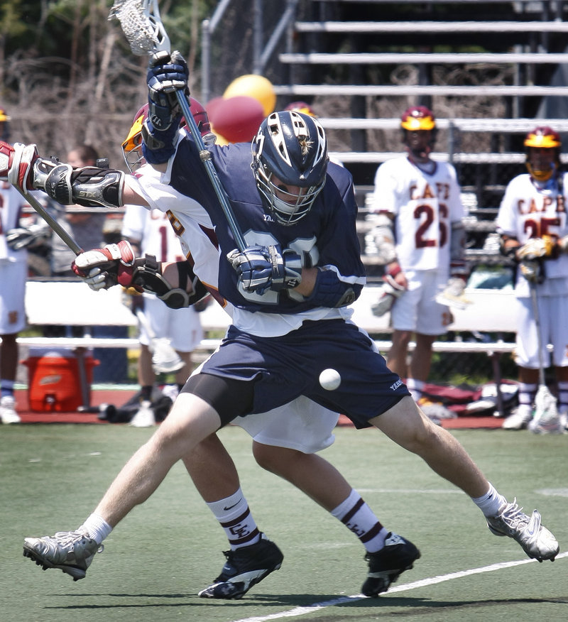 David Dietz of Yarmouth tries to keep control of the ball Saturday while pressured by Timmy Takach of Cape Elizabeth during Cape's 7-6 win in the Class B state final at Fitzpatrick Stadium.