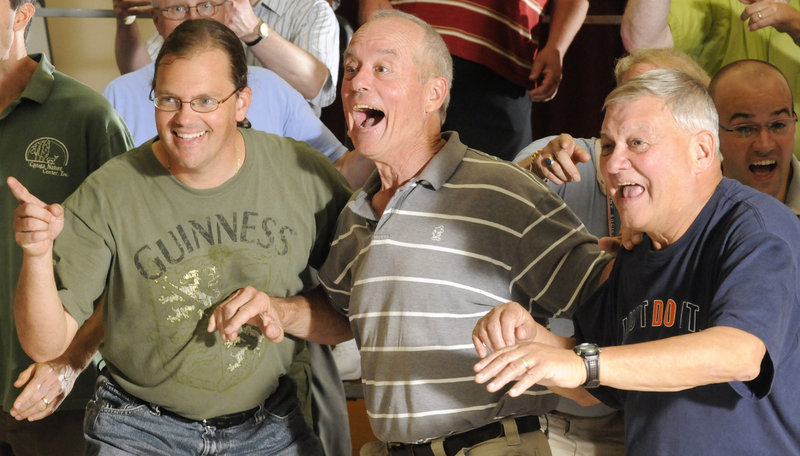 Scott Kolda, left, John Gross and Wally Duplessie rehearse Irving Berlin's "Alexander's Ragtime Band" at the Harrison Middle School cafeteria in Yarmouth. They are members of the Downeasters Barbershop Chorus, which will perform Friday at the International Barbershop Convention in Philadelphia.