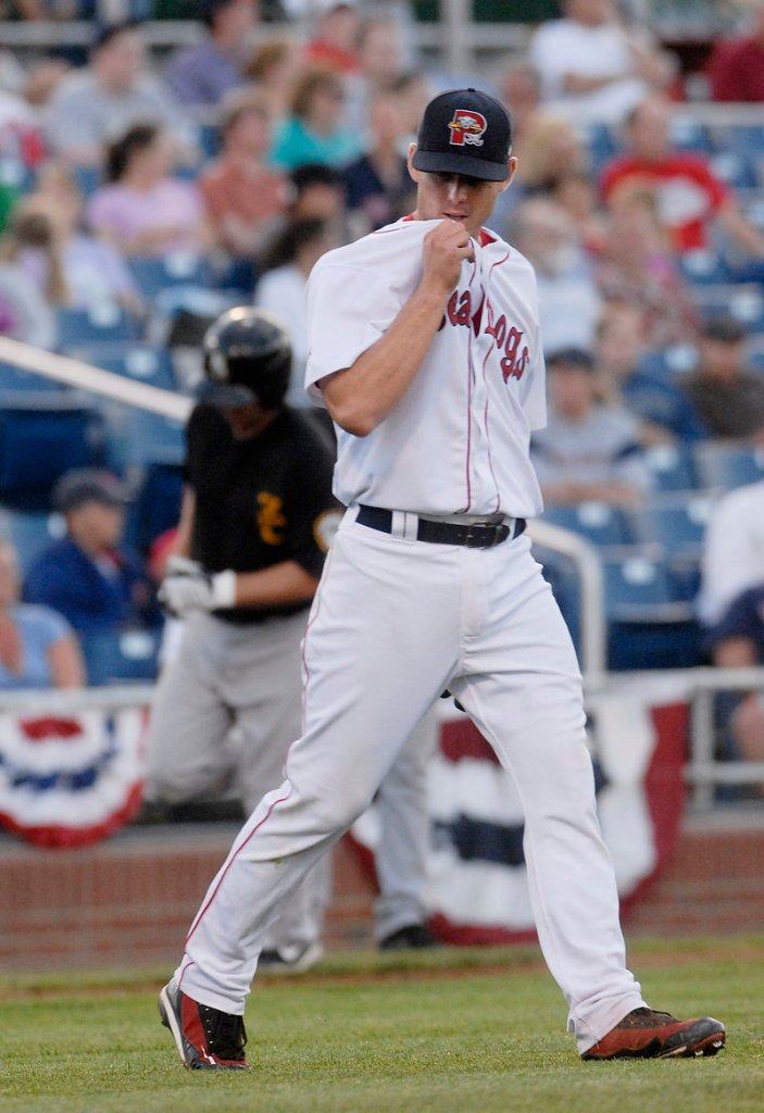 Sea Dogs starter Jeremy Kehrt looks away as New Hampshire's David Cooper rounds third base on his way to home after his second home run of the game.