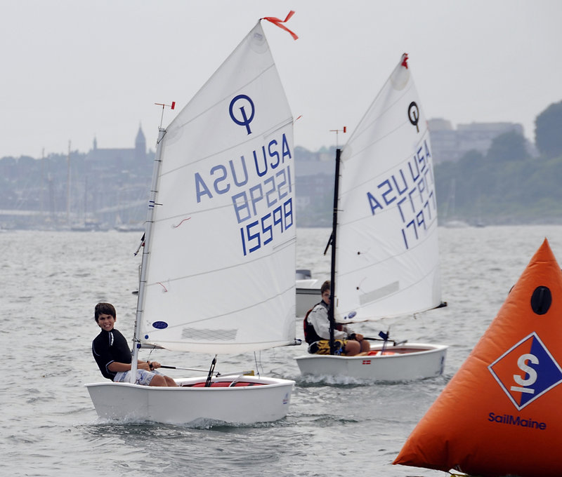 David Segura of MDI remains ahead of Cliff Gilman of FAST during the first Optimist race on Casco Bay. The Optimist class is for a more competitive class of small boats.