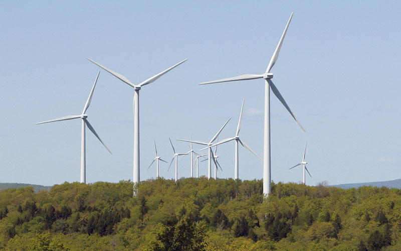 Wind turbines tower over the landscape at the Stetson wind farm in Danforth. The wind farm has 55 turbines, which are 262 feet tall with a blade diameter of 253 feet. May 11, 2010, file photo.