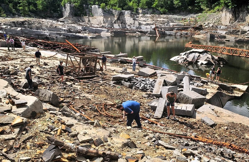 People look around on the floor of Stinchfield Quarry during a tour on Sunday afternoon in Hallowell.