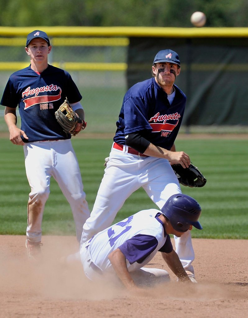 Jacob Lachance of Augusta fires to first to complete a double play after forcing Sam Balzano of Nova Seafood at second base. The Augusta shortstop is Colin McKee.