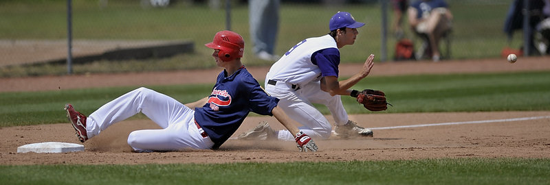 Charlie Partridge of Augusta slides into third base Saturday as Cameron Brown of Nova Seafood takes the late throw. Augusta opened an 11-2 lead in the first two innings and went on to a 16-7 victory that ended Nova Seafood’s title reign.