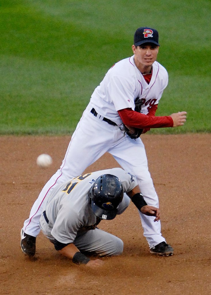 Nate Spears watches his throw to first base as he turns a double play over the head of Trenton’s Edwar Gonzalez on Saturday. The Sea Dogs got the pair of outs but lost the game 5-2 as two Trenton pitchers shut down Portland.