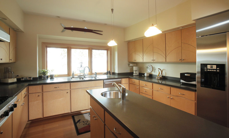 Lynn Shaffer's contemporary kitchen has wood, metal and glass features that reflect the character of the rest of the house.