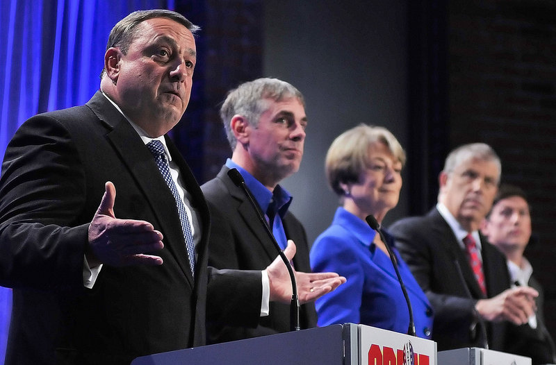 Republican Paul LePage, left, speaks as independent Shawn Moody, Democrat Libby Mitchell, independent Eliot Cutler and independent Kevin Scott listen Saturday night during the first of The Great Debates at the University of Maine at Augusta.