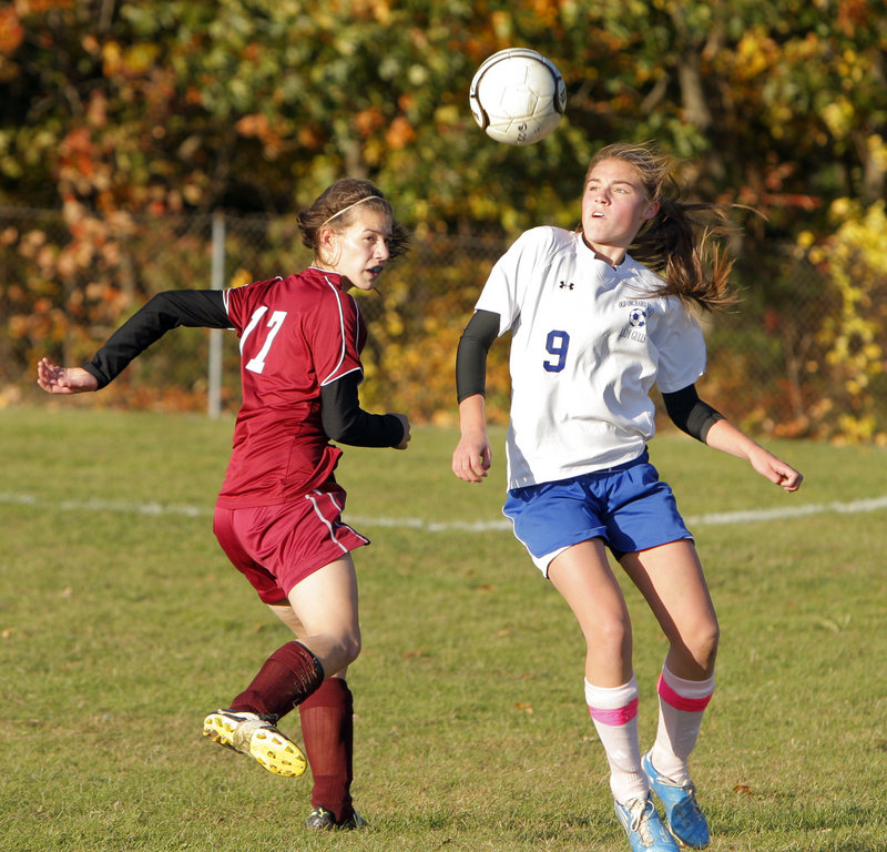 Olivia Dubois of Old Orchard Beach tries to control the ball as Richmond's Katie Webster closes in during Monday's game at Old Orchard Beach. OOB likely secured a Western Class C tournament berth with its 3-0 victory.