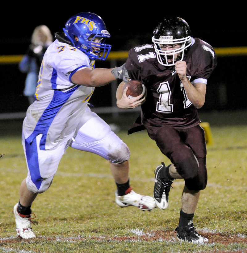 Andrew Edwards of Falmouth gives chase against Mike Leeman of Greely during their Western Class B game at Cumberland. Next stop: a coin flip.