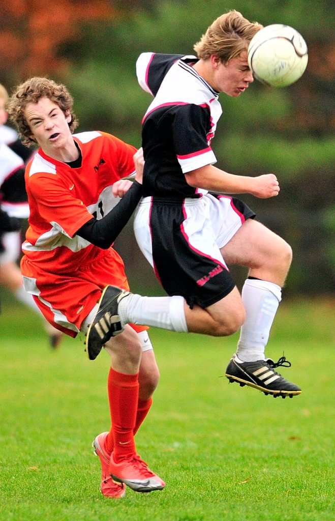 Lukas Hjertquist, right, of Hall-Dale heads the ball away from NYA s Matthew Kilber during their Western Class C boys soccer semifinal Saturday. NYA won, 2-1.