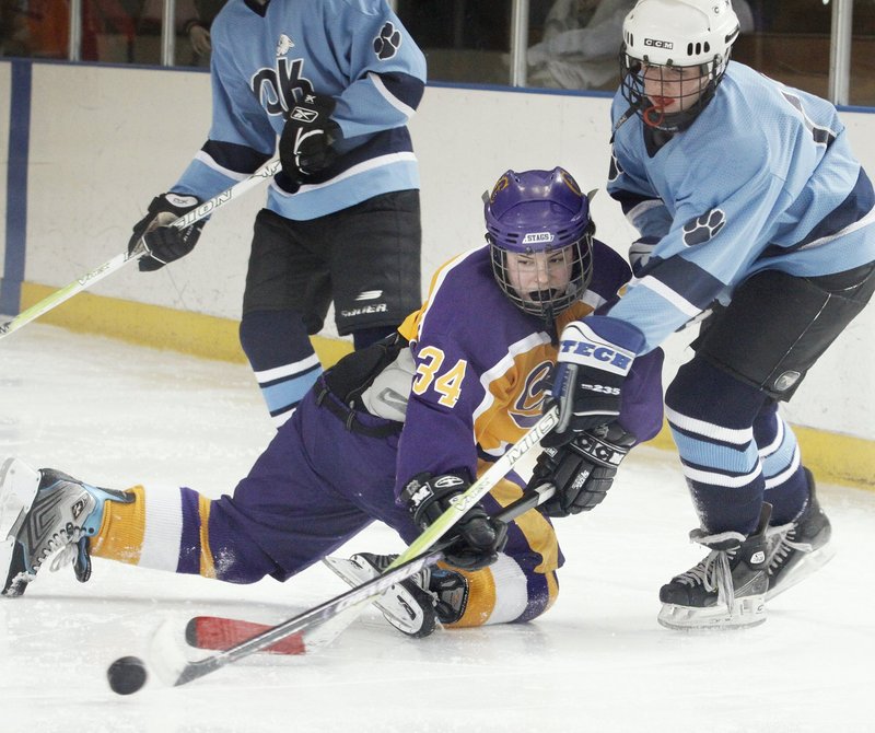 Katie Roy of Cheverus, center, battles with Julia Hird of York during a heated game last year. St. Dom's, Scarborough and Cheverus may be favorites, York expects to contend.