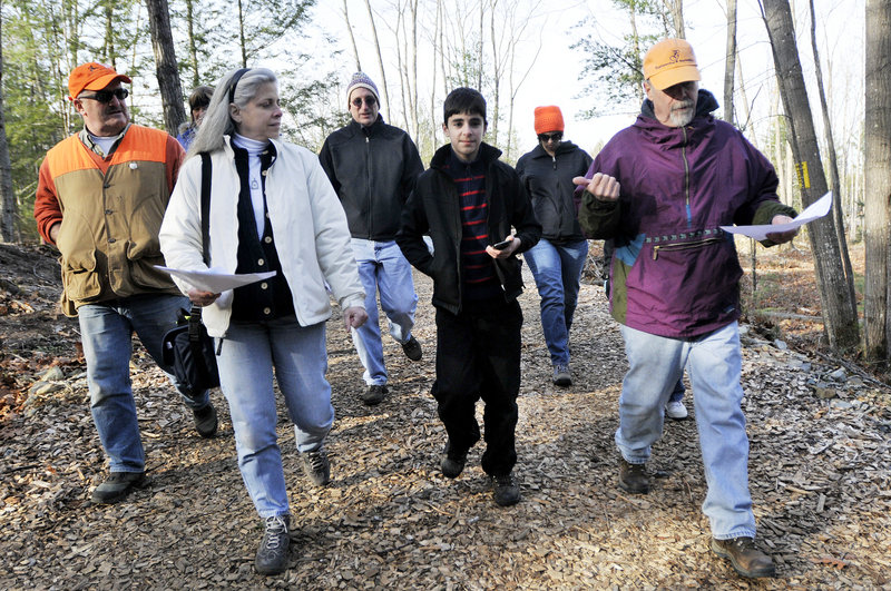 Paul Gadbois, right, an advisory board member with Blandings Park Wildlife Sanctuary in Biddeford, leads a hike in the preserve on Sunday. With him, from left, are Paul Brady, Michelle Larkin, Mark Larkin, Steven Larkin and Amanda Noble.