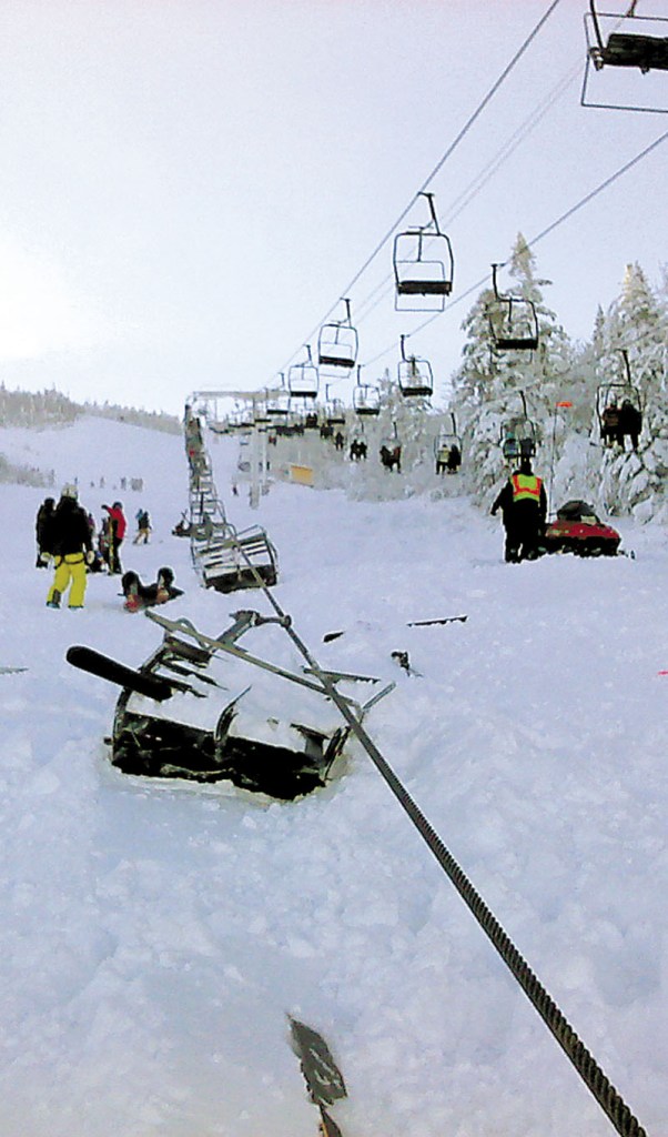 Chairs on the Spillway East chairlift at Sugarloaf rest in the snow after falling as far as 30 feet after the cable derailed Tuesday. The derailment at Maine's tallest ski mountain Tuesday, sent skiers and snowboarders to the ground, injuring at least eight people.