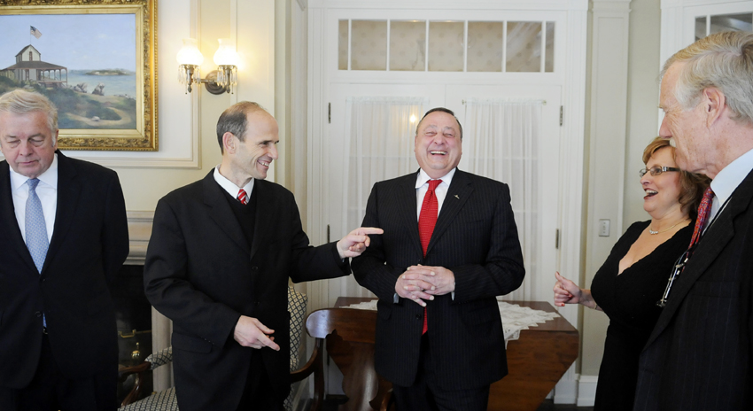 Governors Joe Brennan, left; John Baldacci, second from left; and Angus King, right, speak with Gov.-elect Paul LePage and his wife, Ann, during a reception at the Blaine House this morning.