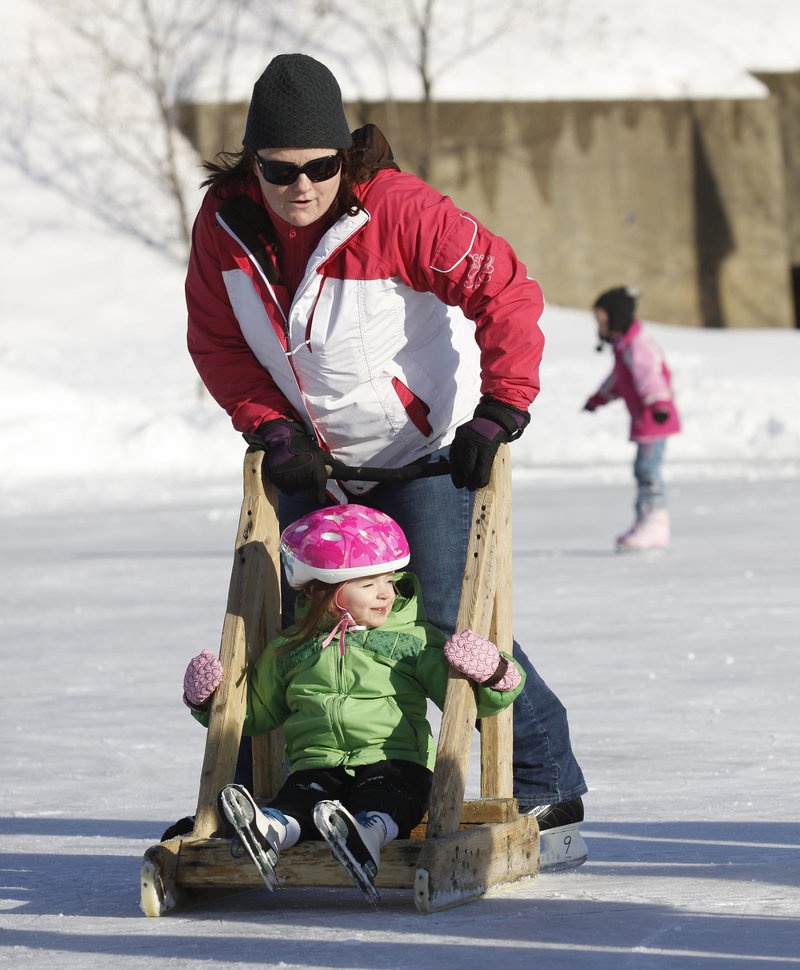 Heather LeClair of Boston pushes her niece Mackenzie Ames of Biddeford, who was celebrating her fourth birthday at the rink Saturday.