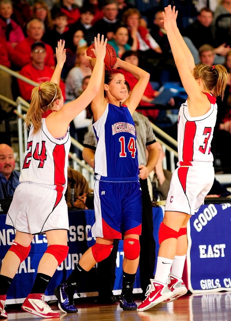 Messalonskee junior forward Megan Pelletier is double teamed by Emily Sanford, left, and Ameila Diplock of Cony during their Eastern Class A semifinal Wednesday afternoon at the Augusta Civic Center. Messalonskee won, 48-44.