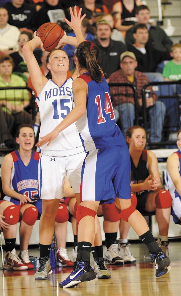 TOUGH DEFENSE: Morse senior guard Tarra Burr, left, looks for a pass around Messalonskee junior forward Megan Pelletier during the Eastern Maine Class A tournament Friday at the Augusta Civic Center. cheering augusta