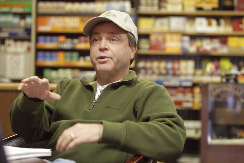 Dan Ducharme, owner of DAD’s Smoke Shop in Biddeford and pictured in his Alfred Street shop on Tuesday, is a proponent of building a parking garage in downtown Biddeford.