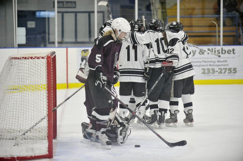 Meg Finlay of Greely can only skate away Wednesday night after St. Dom's scored the first goal of a 3-2 victory to win the Eastern Maine title.