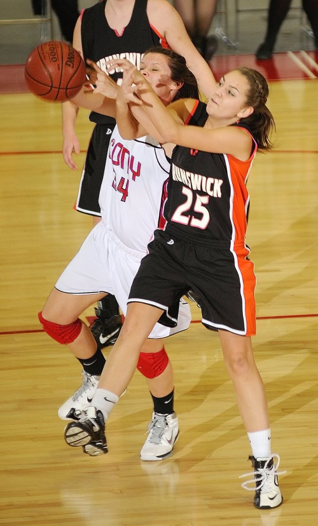 Melanie Guzman, left, of Cony and Becky Champagne of Brunswick compete for a rebound Friday night during their Eastern Class A quarterfinal at the Augusta Civic Center. Fourth-seeded Cony came away with a 41-32 victory.