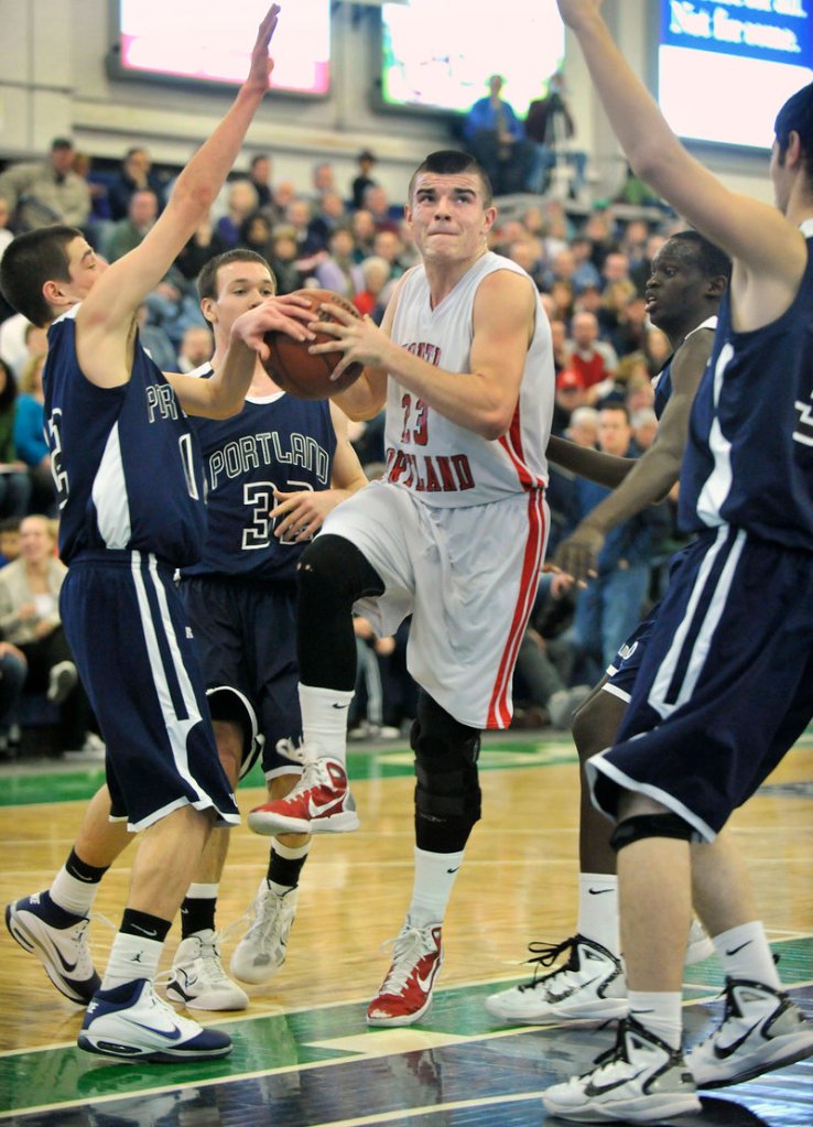 Vukasin Vignjevic of South Portland looks to penetrate against the heart of Portland’s defense as Justin Zukowski gets a hand on the ball.