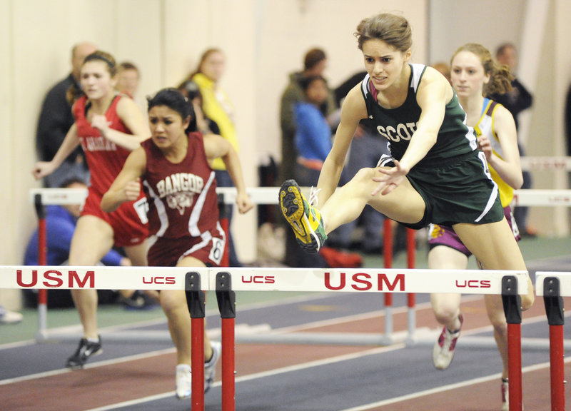 Peyton Dostie of Bonny Eagle clears a hurdle while winning the third heat of the 55 hurdles in the Class A meet at Gorham. Dostie finished second to Sarah Perkins of Gorham in the final.