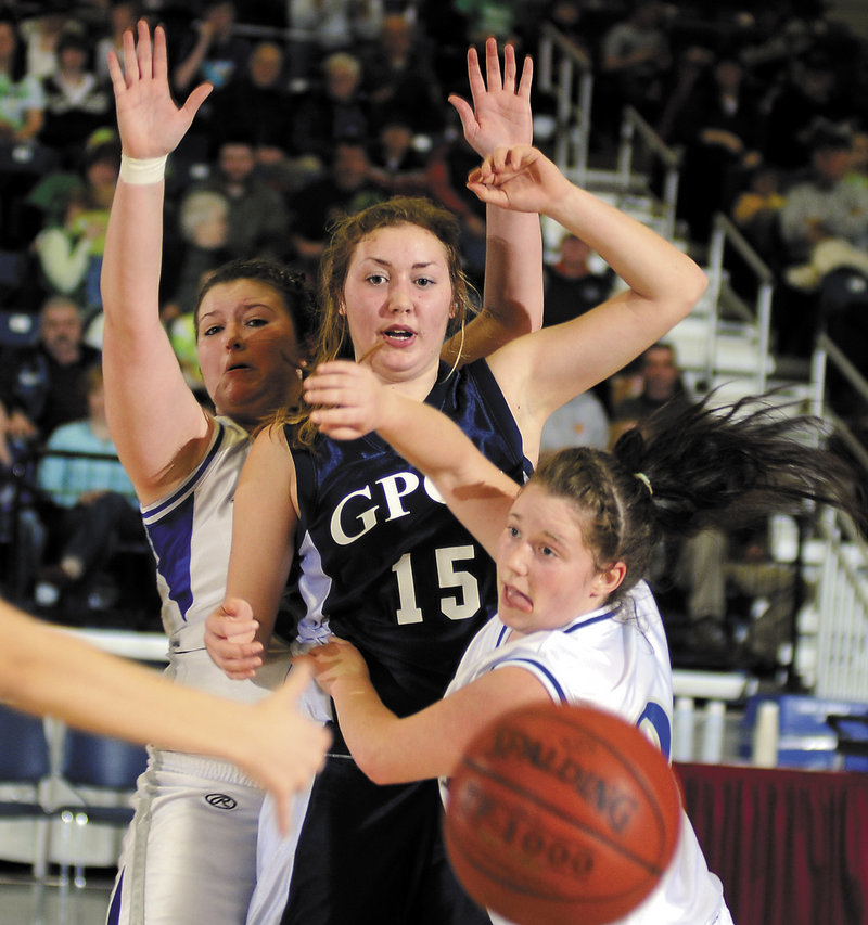 Robyn Waugh of Greater Portland Christian draws attention from Cindy Schultz, foreground, and Hali McQuilkin of Valley in Western Class D. Valley won, 54-53.