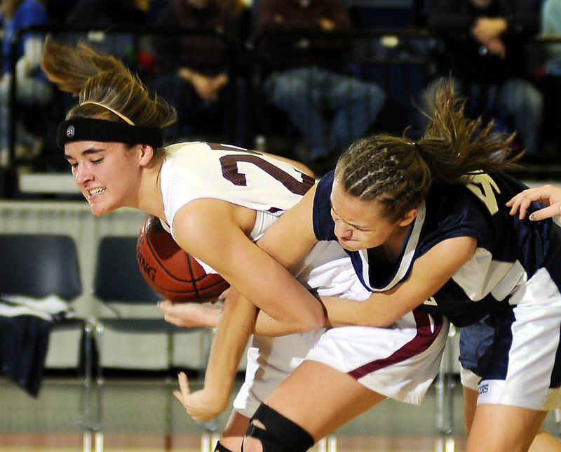 Jamie Plummer of Richmond has the ball and is determined that Gretel Breton of Greenville doesn’t get it. Richmond won the Western Class D semifinal at Augusta, 34-22, and will meet Valley next.