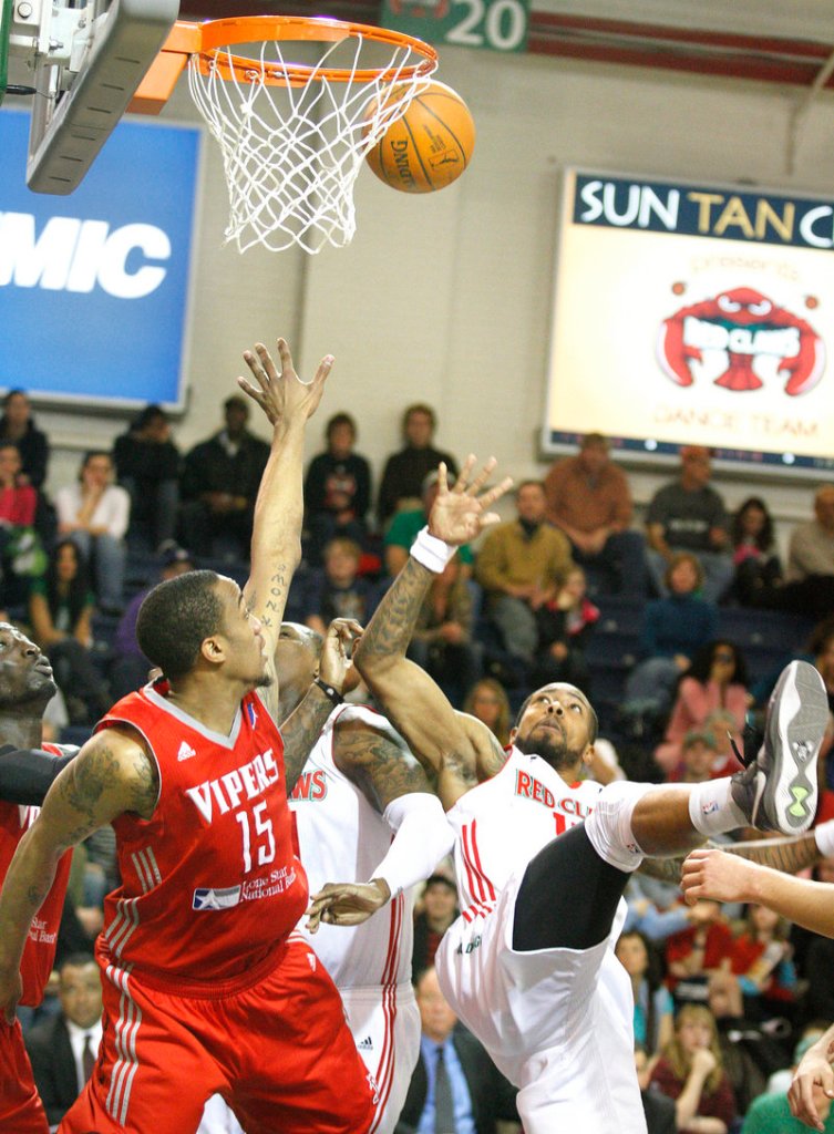 Maine's Antonio Anderson, right, watches his unlikely shot go in after he was fouled by Rio Grande Valley's Patrick Sullivan, left, on Sunday afternoon at the Portland Exposition Building.