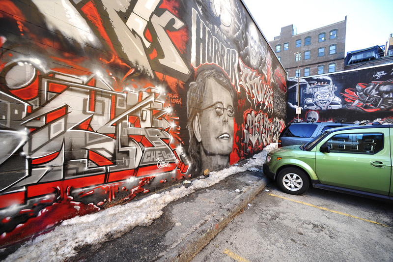 Graffiti artwork covers a wall designated for the activity at the Asylum nightclub in Portland.