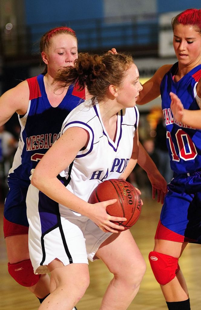 Messalonskee defenders Mickelle McCafferty, left, and Abagail Stacey double team Hampden's Courtney Doyon.