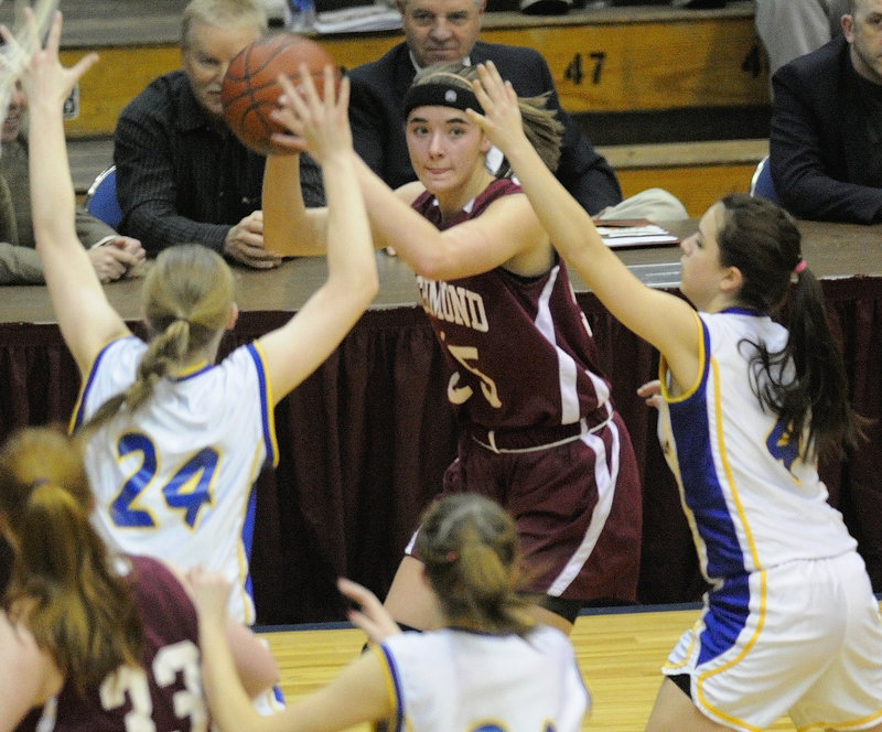 Rebecca Campbell, left, and Rayah Saucier close in on Richmond's Jamie Plummer during Washburn's 43-30 win Saturday in the Class D girls' state final.